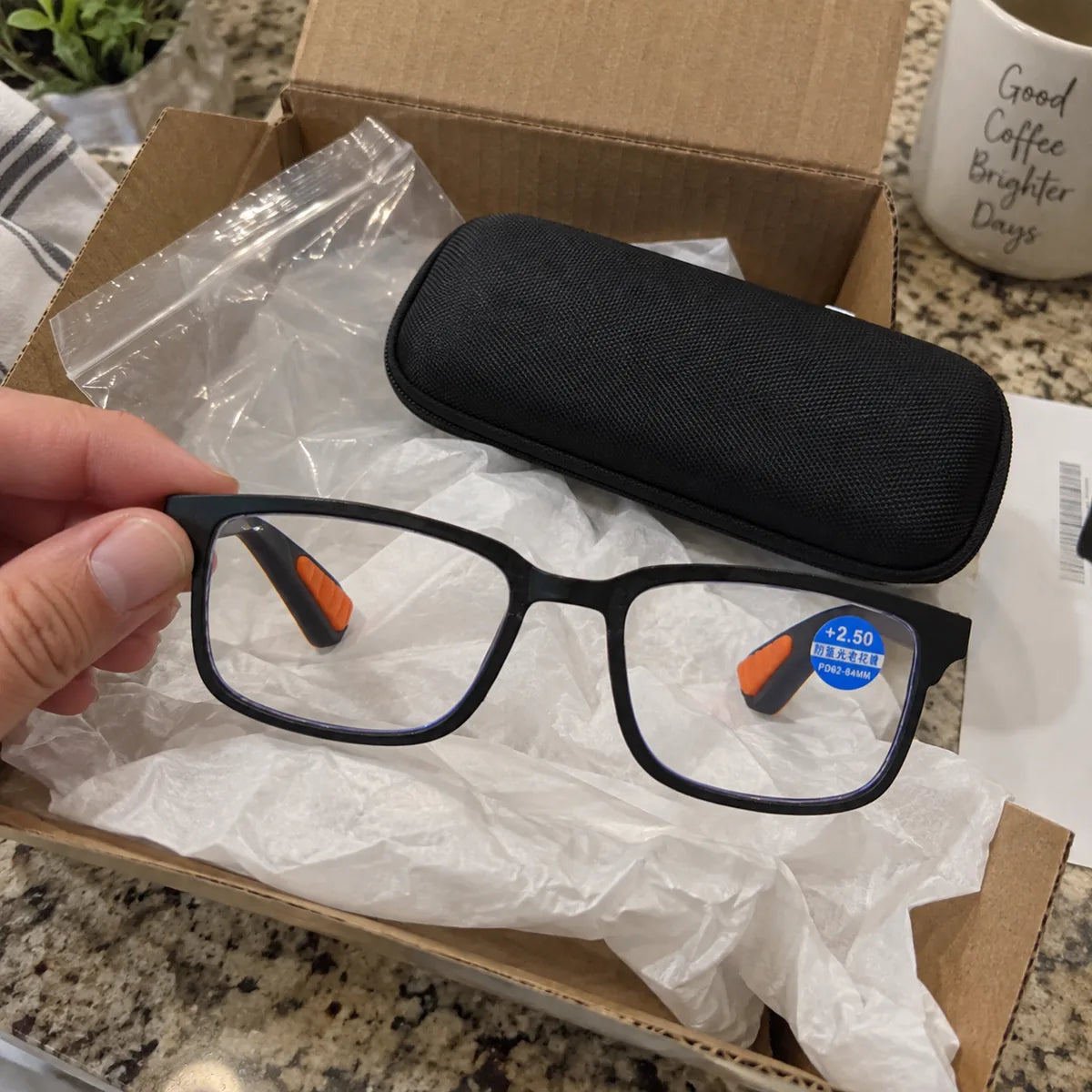 Reading glasses and case after unboxing