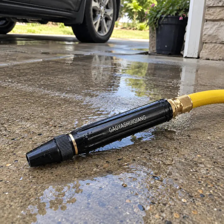 Close-up of sprayer nozzle connecting to yellow hose