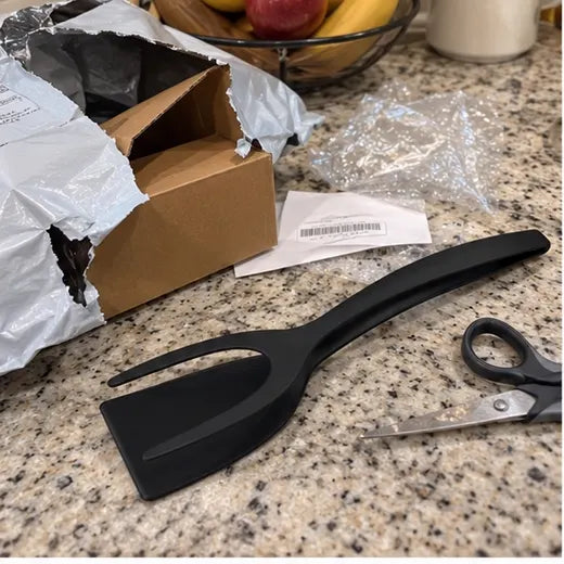 Grip and flip spatula tongs unboxed on a kitchen counter