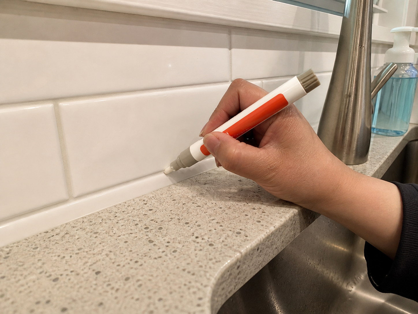 Customer sink backsplash grout touch-up photo