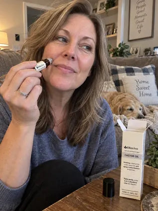 Woman applying eye roller serum before an evening plan