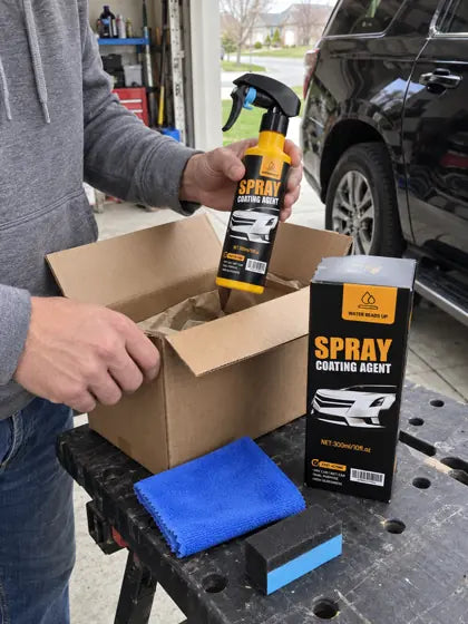 Customer unpacking car coating spray in a garage