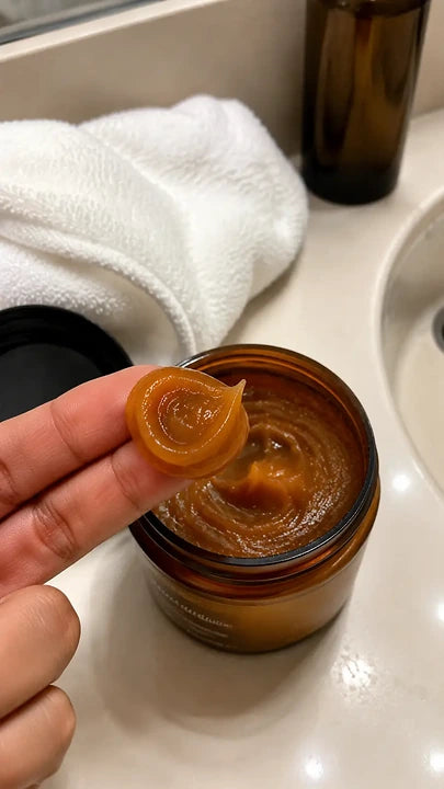 Open NAVOZILO Batana Oil jar in warm product setting