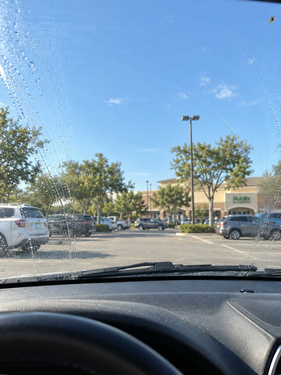 Windshield being cleaned during an everyday drive