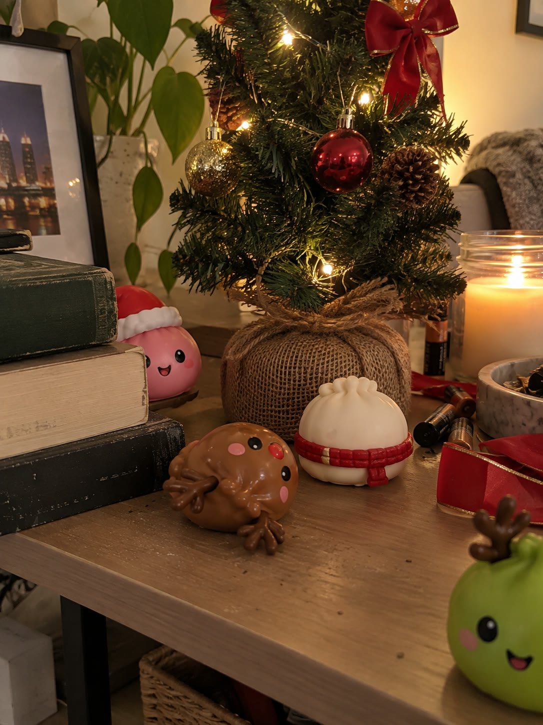Mini Christmas squishies displayed around a small tabletop tree