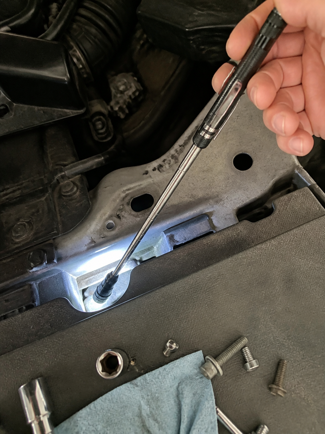 Customer review photo showing magnetic pickup tool retrieving metal parts
