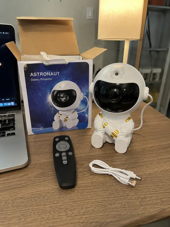 Astronaut galaxy projector with packaging, remote, cable, and box