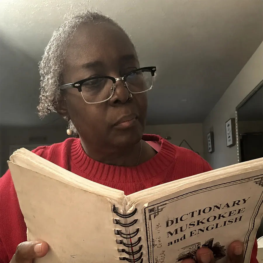 Linda keeps her blue-light reading glasses on while reading and looking away