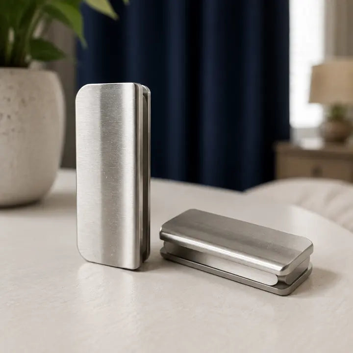 Close-up of silver metal magnetic curtain clips