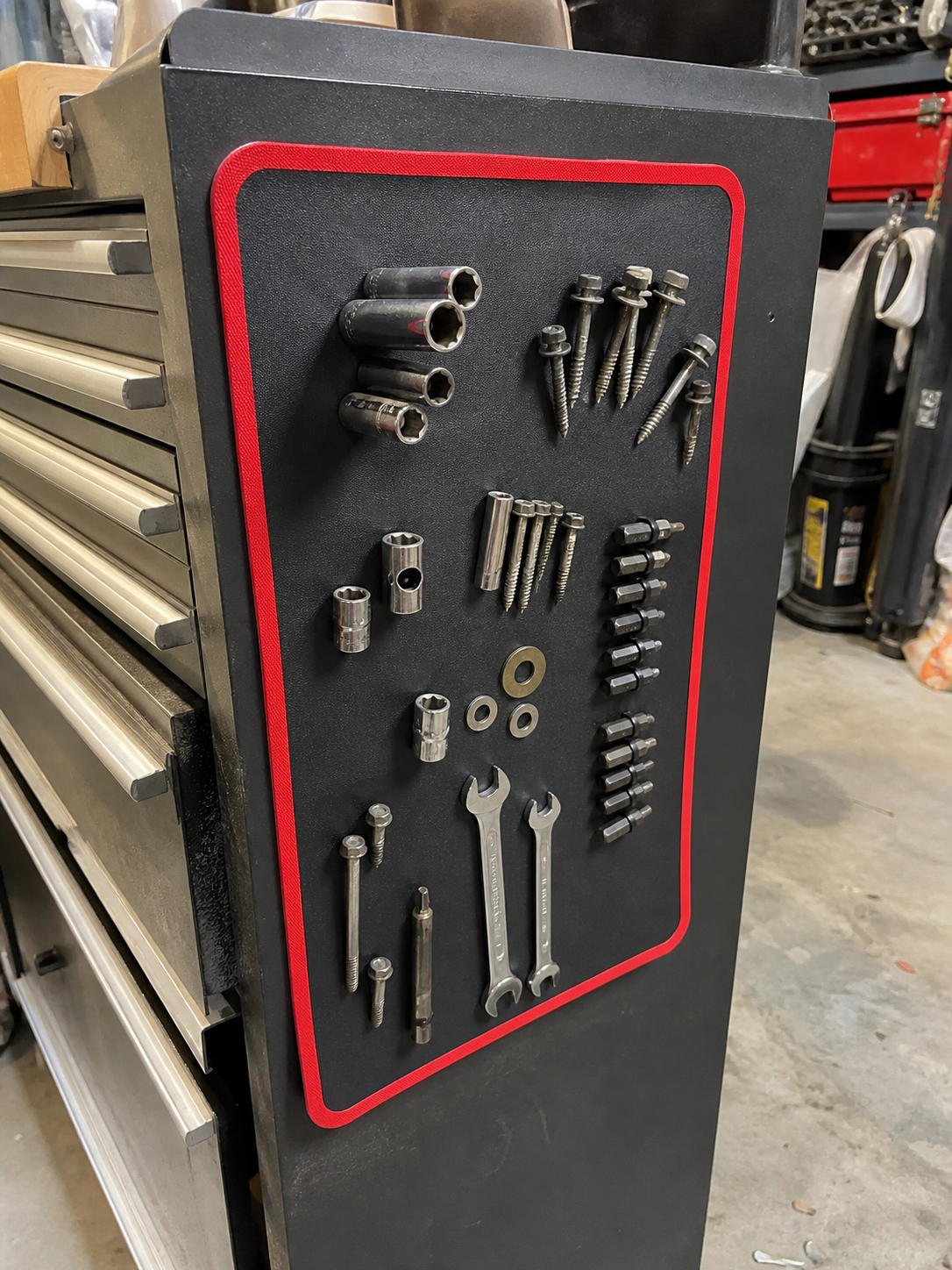 Customer review photo showing the magnetic mat attached to a toolbox side.