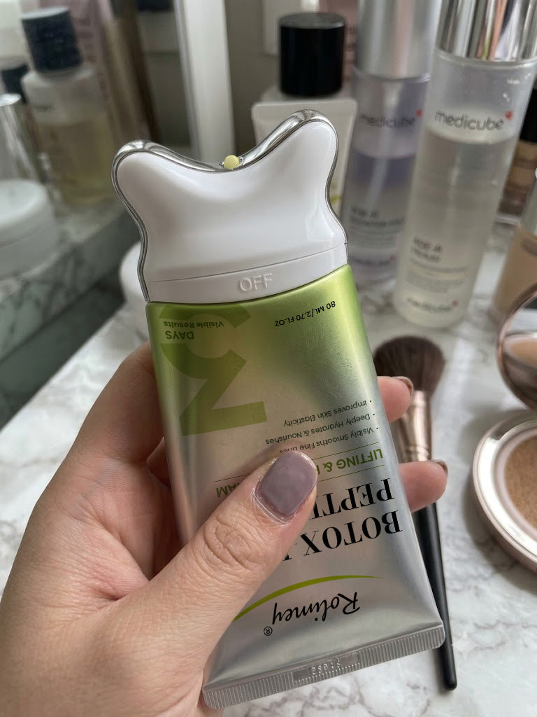Customer holding Rolimey cream upside down