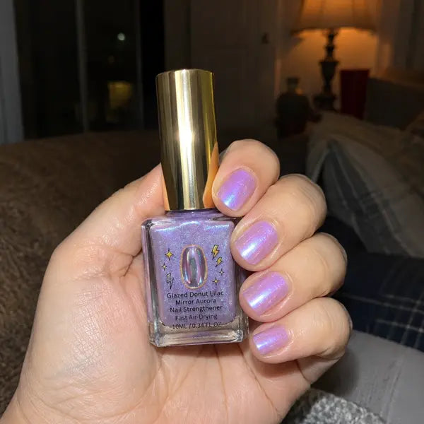 Customer showing glowing lilac nails at night