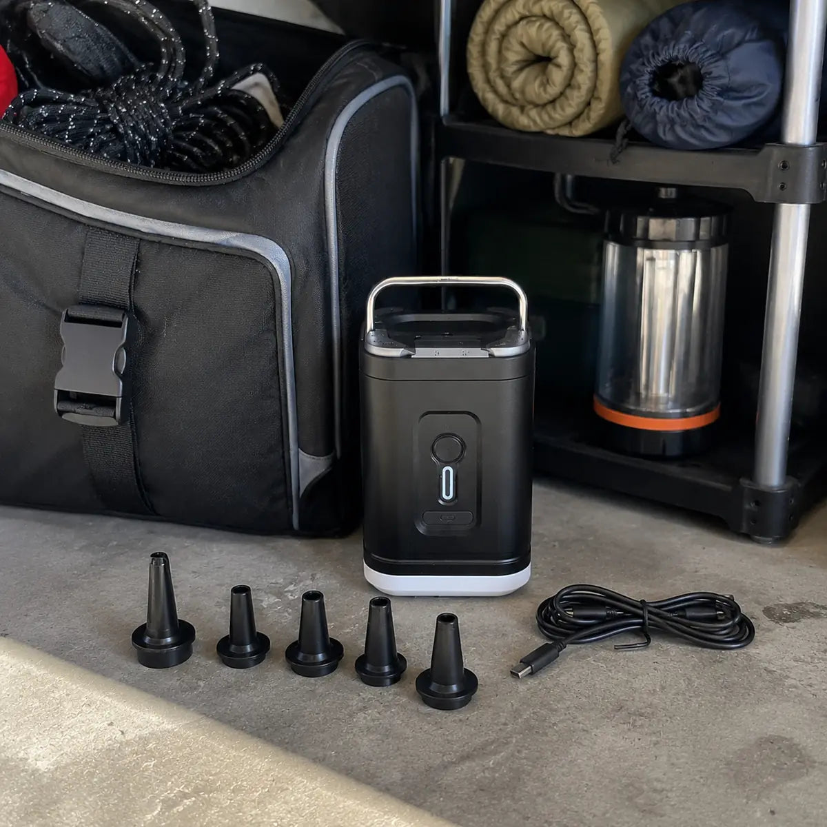 Andrew K. customer photo: air pump with five nozzles and USB-C cable in a camping gear setup