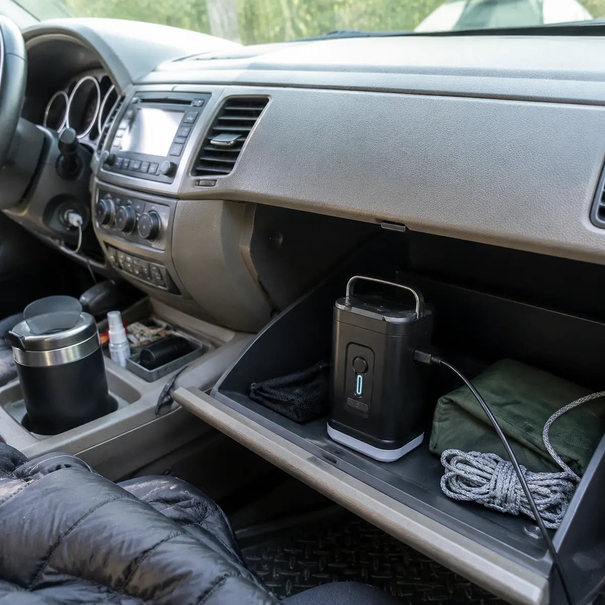 Scott W. customer photo: air pump charging with Type-C cable in a car glove box