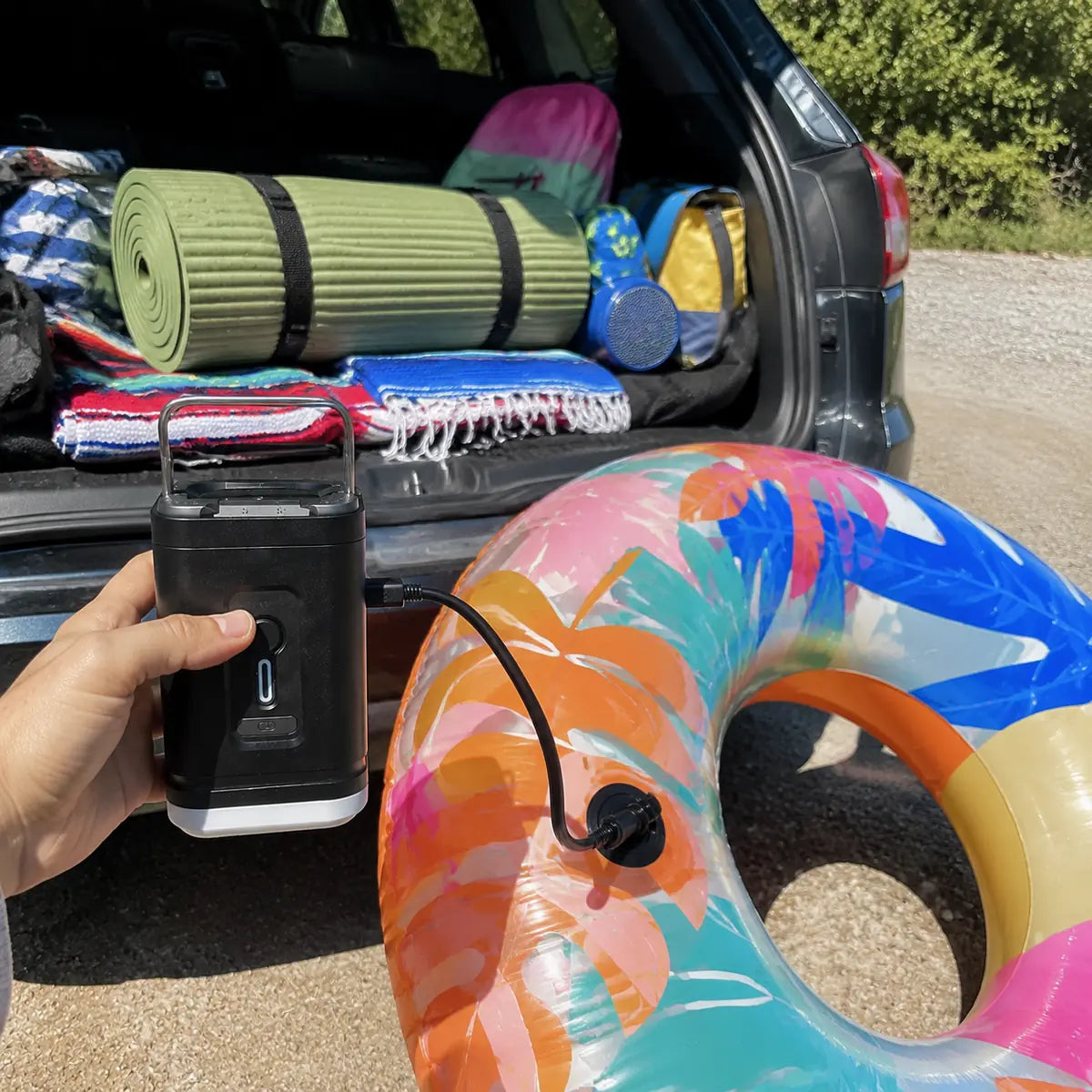 Daniel F. customer photo: air pump inflating a pool float near the pool