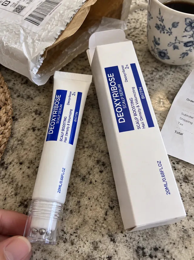 Scalp serum tube and box after delivery on a kitchen counter