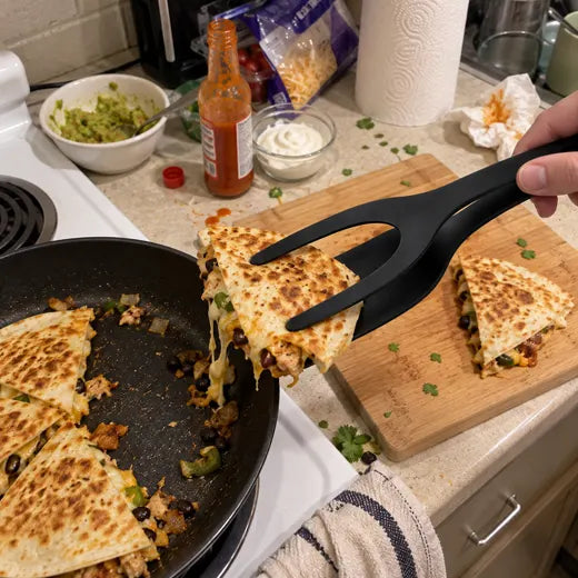 Grip and flip spatula tongs lifting a quesadilla