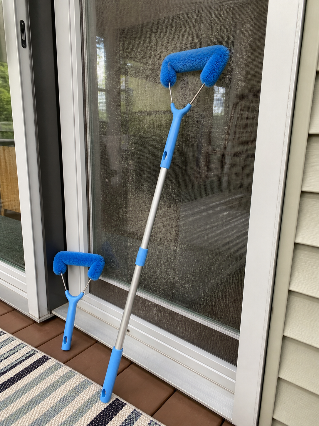Customer photo of short and long screen brush combo on a sliding screen door.