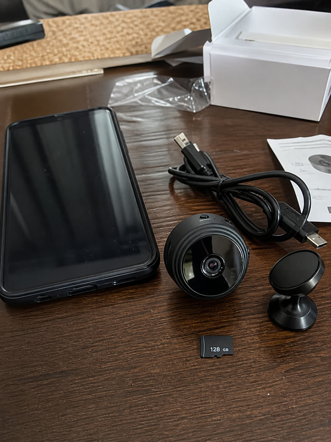 Mini pinhole camera kit with 128 GB memory card, phone, cable, and stand
