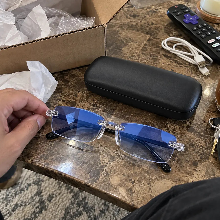 Blue-light rimless glasses with case after unboxing